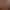 Salle de massage "Espace Zen" avec table de massage, bougies allumées, serviettes et vase de fleurs
